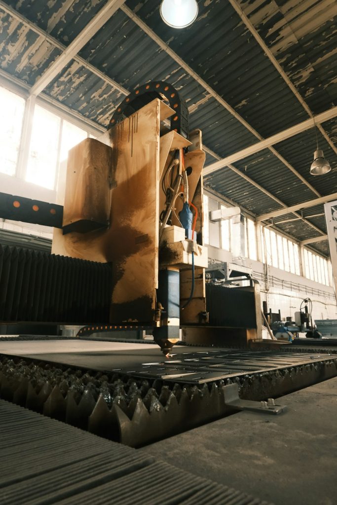 a-large-machine-in-a-large-building-with-lots-of-windows-vkekdv9muvs