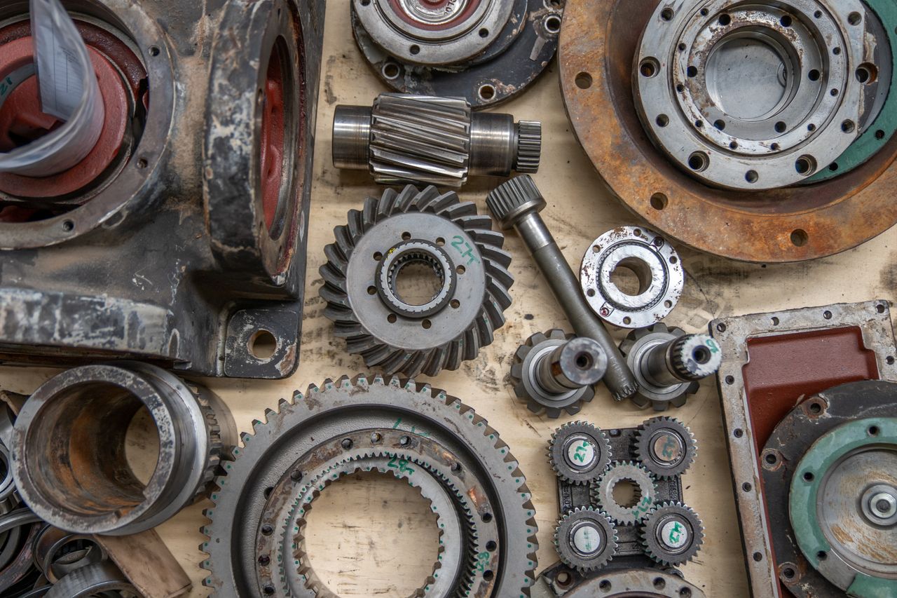 Crafting Captivating Headlines: Your awesome post title goes here Detailed shot of industrial gears and mechanical parts in a workshop setting.