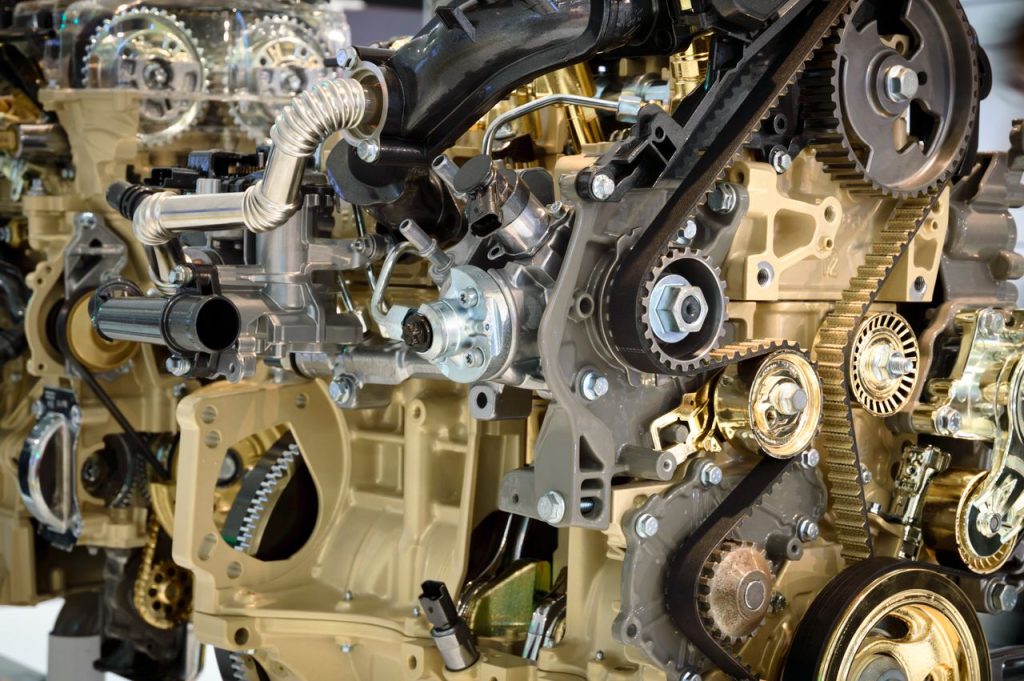 Detailed view of a modern car engine showcasing gears and mechanical components.